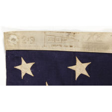 13 STARS ARRANGED IN A 3-2-3-2-3 LINEAL CONFIGURATION ON A SMALL-SCALE ANTIQUE AMERICAN FLAG MADE DURING THE FIRST HALF OF THE 1890's