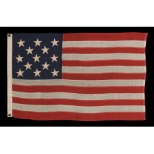 13 STARS ARRANGED IN A 3-2-3-2-3 PATTERN ON A SMALL-SCALE ANTIQUE AMERICAN FLAG MADE IN THE PERIOD BETWEEN THE LAST DECADE OF THE 19TH CENTURY AND THE FIRST QUARTER OF THE 20TH