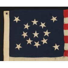 13 STARS ARRANGED IN A MEDALLION PATTERN ON A SMALL-SCALE ANTIQUE AMERICAN FLAG OF THE 1895-1920's ERA