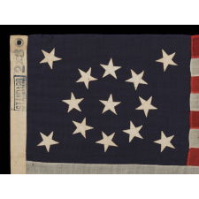 13 STARS ARRANGED IN A MEDALLION PATTERN ON A SMALL-SCALE FLAG OF THE 1895-1926 ERA