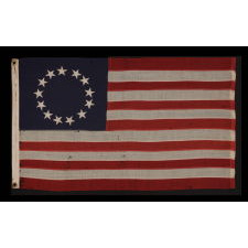 13 STARS IN THE BETSY ROSS PATTERN ON A SMALL-SCALE ANTIQUE AMERICAN FLAG OF THE 1895-1920’s ERA