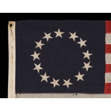 13 STARS IN THE BETSY ROSS PATTERN ON A SMALL-SCALE ANTIQUE AMERICAN FLAG OF THE 1895-1920’s ERA