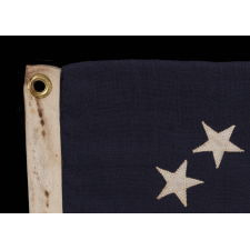 13 STARS IN THE BETSY ROSS PATTERN ON A SMALL-SCALE ANTIQUE AMERICAN FLAG OF THE 1895-1920’s ERA