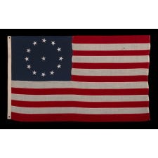 13 STARS IN A CIRCULAR VERSION OF THE 3RD MARYLAND PATTERN, ON AN ESPECIALLY ATTRACTIVE, SMALL SCALE, ANTIQUE AMERICAN FLAG, MADE IN THE 1890's-1910 ERA