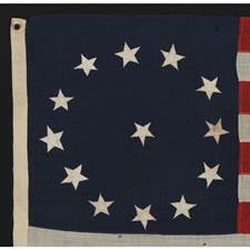 13 STARS IN A CIRCULAR VERSION OF THE 3RD MARYLAND PATTERN, ON A SMALL SCALE FLAG MADE IN THE 1895-1920's ERA