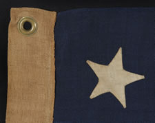 13 STARS, CIVIL WAR PERIOD, 1861-65, IN A RARE, SMALL SIZE AMONG KNOWN EXAMPLES AND WITH A RARE VARIATION OF A WREATH DESIGN THAT HAS MORE OF AN OCTAGON PROFILE THAN CIRCULAR