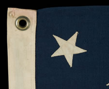 13 STARS IN A MEDALLION CONFIGURATION ON A SMALL-SCALE FLAG OF THE 1890-1920'S ERA