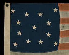 13 STARS IN A MEDALLION CONFIGURATION ON A SMALL-SCALE FLAG OF THE 1890-1910 ERA