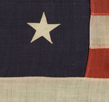 13 STARS IN A MEDALLION CONFIGURATION ON A SMALL-SCALE FLAG OF THE 1895-1920'S ERA