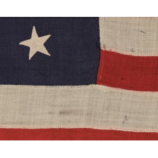 13 STARS IN A MEDALLION CONFIGURATION ON A SMALL-SCALE ANTIQUE AMERICAN FLAG OF THE 1895-1920’s ERA