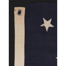 13 STARS IN A MEDALLION CONFIGURATION ON A SMALL-SCALE ANTIQUE AMERICAN FLAG OF THE 1895-1920’s ERA