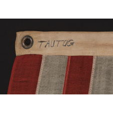 13 STARS IN A MEDALLION CONFIGURATION ON A SMALL-SCALE ANTIQUE AMERICAN FLAG OF THE 1895-1926 ERA, SIGNED "TAUTOG," PROBABLY FLOWN ON THE YACHT OF THAT NAME BY OWNER GEORGE GARDINER FRY, WHO WON MANY RACES WITH HER AT THE TURN-OF-THE-CENTURY