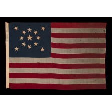 13 STARS IN A MEDALLION CONFIGURATION ON A SMALL-SCALE ANTIQUE AMERICAN FLAG OF THE 1895-1926 ERA, MARKED "STANDARD"