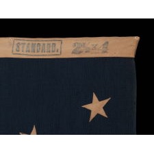 13 STARS IN A MEDALLION CONFIGURATION ON A SMALL-SCALE ANTIQUE AMERICAN FLAG OF THE 1895-1926 ERA, MARKED "STANDARD"