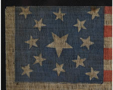 13 STARS, MEDALLION PATTERN, MADE SOMETIME BETWEEN THE CIVIL WAR (1861-65) AND THE 1876 CENTENNIAL OF OUR NATION'S INDEPENDENCE, AN UNUSUAL EXAMPLE WITH ESPECIALLY ATTRACTIVE STARS AND AN UPSIDE-DOWN CENTER STAR