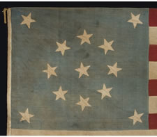 13 STARS IN A MEDALLION PATTERN ON A BEAUTIFUL, FADED, CORNFLOWER BLUE CANTON, CIVIL WAR PERIOD (1861-65) OR CENTENNIAL (1876), A WONDERFUL AND DYNAMIC EXAMPLE