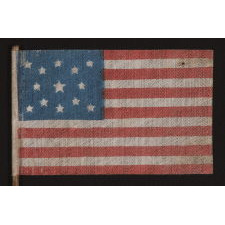 13 STARS IN A MEDALLION PATTERN ON AN ANTIQUE AMERICAN FLAG MADE FOR THE 1876 CENTENNIAL CELEBRATION