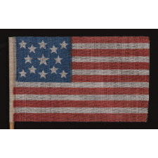 13 STARS IN A MEDALLION PATTERN ON AN ANTIQUE AMERICAN FLAG MADE FOR THE 1876 CENTENNIAL CELEBRATION