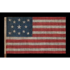 13 STARS IN A MEDALLION PATTERN ON AN ANTIQUE AMERICAN FLAG MADE FOR THE 1876 CENTENNIAL CELEBRATION