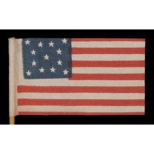 13 STARS IN A MEDALLION PATTERN ON AN ANTIQUE AMERICAN PARADE FLAG MADE BETWEEN APPROXIMATELY 1910 AND THE 1926 SESQUECENTENNIAL OF AMERICAN INDEPENDENCE