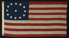 13 STARS IN AN OVAL FORM OF THE 3RD MARYLAND PATTERN, ON AN ATTRACTIVE, SMALL-SCALE FLAG MADE IN THE 1890-1920's ERA