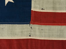 13 STARS IN AN OVAL FORM OF THE 3RD MARYLAND PATTERN, ON AN ATTRACTIVE, SMALL-SCALE FLAG MADE IN THE 1890-1920's ERA