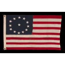 13 STARS IN AN OVAL VERSION OF THE 3RD MARYLAND PATTERN, ON A SMALL SCALE, ANTIQUE AMERICAN FLAG MADE BETWEEN APPROXIMATELY 1926 AND THE WWII ERA