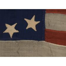 13 STARS IN A VARIATION OF A VERY RARE CONFIGURATION CALLED THE "TRUMBULL PATTERN", NAMED BECAUSE OF THE USE OF FLAGS IN THIS BASIC DESIGN-A SQUARE OF STARS SURROUNDING A SINGLE CENTER STAR-IN THREE OF JOHN TRUMBULL'S 18TH CENTURY PAINTINGS OF HIS COMMANDER, GEORGE WASHINGTON, ca 1830-1850's