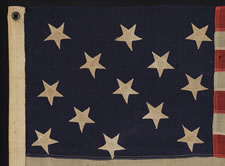 13 UPSIDEDOWN STARS IN A 3-2-3-2-3 PATTERN ON A SMALL-SCALE FLAG OF THE 1895-1910 ERA: