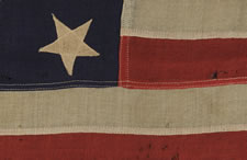 13 UPSIDEDOWN STARS IN A 3-2-3-2-3 PATTERN ON A SMALL-SCALE FLAG OF THE 1895-1910 ERA: