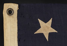 13 UPSIDEDOWN STARS IN A 3-2-3-2-3 PATTERN ON A SMALL-SCALE FLAG OF THE 1895-1910 ERA: