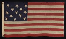 13 UPSIDEDOWN STARS IN A 3-2-3-2-3 PATTERN ON A SMALL-SCALE FLAG OF THE 1895-1910 ERA: