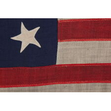 18 STAR ANTIQUE AMERICAN FLAG WITH 13 STRIPES, A “DISUNION” FLAG, MADE WITH AN ABOLITIONIST MESSAGE, circa 1859-1861, EXCLUDING THE SLAVE STATES; WITH A 19TH STAR ADDED ON THE OBVERSE; OWNED BY HARVARD-TRAINED, MASSACHUSETTS PHYSICIAN BENJAMIN CUSHING, WHO VOLUNTEERED AS A U.S. ARMY SURGEON, DEVOID OF RANK OR PAY, STATIONED AT FORT MONROE, VIRGINIA, ‘CONTRABAND CAMP’ FOR ESCAPING SLAVES AND THE ONLY UNION-CONTROLLED, FORTIFIED BASE IN THE UPPER SOUTH