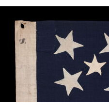 18 STAR ANTIQUE AMERICAN FLAG WITH 13 STRIPES, A “DISUNION” FLAG, MADE WITH AN ABOLITIONIST MESSAGE, circa 1859-1861, EXCLUDING THE SLAVE STATES; WITH A 19TH STAR ADDED ON THE OBVERSE; OWNED BY HARVARD-TRAINED, MASSACHUSETTS PHYSICIAN BENJAMIN CUSHING, WHO VOLUNTEERED AS A U.S. ARMY SURGEON, DEVOID OF RANK OR PAY, STATIONED AT FORT MONROE, VIRGINIA, ‘CONTRABAND CAMP’ FOR ESCAPING SLAVES AND THE ONLY UNION-CONTROLLED, FORTIFIED BASE IN THE UPPER SOUTH