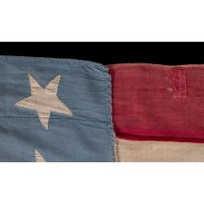 20 STARS AND 11 STRIPES ON AN ANTIQUE AMERICAN FLAG OF THE CIVIL WAR PERIOD, HOMEMADE AND ENTIRELY-HAND-SEWN, WITH ITS LIGHT BLUE CANTON RESTING ON THE WAR STRIPE; PROBABLY MADE TO COMMEMORATE THE DECEMBER 10TH, 1817 ADDITION OF MISSISSIPPI AS THE 20TH STATE, AND THE COUNT OF 11 STATES THAT SECEDED FROM THE UNION BETWEEN DECEMBER OF 1860 AND JUNE OF 1861