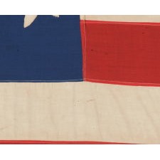 21 HAND-SEWN STARS IN A “GREAT STAR” OR “GREAT LUMINARY” PATTERN, ON AN EXTRAORDINARY SOUTHERN-EXCLUSIONARY FLAG MADE DURING THE CIVIL WAR