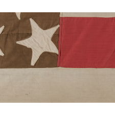 23 STARS ON AN ANTIQUE AMERICAN FLAG MADE IN THE PERIOD BETWEEN 1870 AND THE 1890'S; AN EXTREMELY RARE STAR COUNT, PROBABLY MADE TO COMMEMORATE THE YEAR IN WHICH MAINE ENTERED THE UNION AS THE 23rd STATE, IN 1820