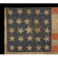 25 STARS IN A VERY RARE LINEAL ARRANGEMENT THAT FEATURES A LARGE CENTER STAR, SOUTHERN-EXCLUSIONARY, THE ONLY KNOWN EXAMPLE IN THIS STYLE AND THE ONLY 19TH CENTURY PARADE FLAG IN THIS STAR COUNT