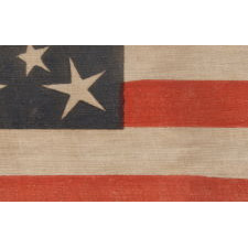 30 STARS ON AN ANTIQUE AMERICAN FLAG OF THE PRE-CIVIL WAR ERA, RARE AND BEAUTIFUL, WITH A MEDALLION CONFIGURATION THAT FEATURES A HALOED CENTER STAR, WISCONSIN STATEHOOD, 1848-1850