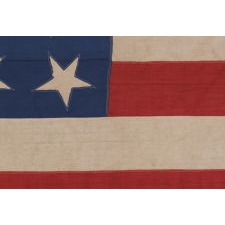 30 STARS ON AN ANTIQUE AMERICAN FLAG MADE IN THE PERIOD BETWEEN 1870 AND THE 1890's, PROBABLY TO COMMEMORATE THE YEAR IN WHICH WISCONSIN ENTERED THE UNION AS THE 30th STATE, IN 1848