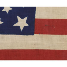 31 STARS IN A FANCIFUL STARBURST OR "GREAT STAR-IN-A-SQUARE", ONE OF THE MOST RARE AND INTERESTING CONFIGURATIONS THAT A COLLECTOR CAN ENCOUNTER, ON A PRE-CIVIL WAR PARADE FLAG, CALIFORNIA STATEHOOD, 1850-1858