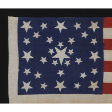 31 STARS IN A FANCIFUL STARBURST OR "GREAT STAR-IN-A-SQUARE", ONE OF THE MOST RARE AND INTERESTING CONFIGURATIONS THAT A COLLECTOR CAN ENCOUNTER, ON A PRE-CIVIL WAR PARADE FLAG, CALIFORNIA STATEHOOD, 1850-1858