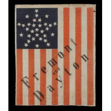 31 STARS IN A VARIATION OF THE "GREAT STAR" PATTERN, MADE FOR THE 1856 PRESIDENTIAL CAMPAIGN OF JOHN FRÉMONT & WILLIAM DAYTON WITH DIAGONAL OVERPRINTED TEXT. FRÉMONT OPENED THE GATEWAY TO CALIFORNIA STATEHOOD AND WAS THE REPUBLICAN PARTY’S FIRST PRESIDENTIAL CANDIDATE: