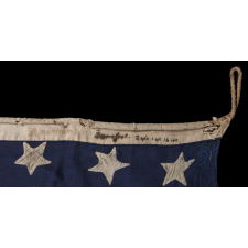 32 STARS ON AN ANTIQUE AMERICAN FLAG WITH ITS CANTON RESTING ON THE WAR STRIPE, MADE IN THE PERIOD WHEN MINNESOTA JOINED THE UNION AS THE 32nd STATE; A VERY RARE STAR COUNT, OFFICIAL FOR JUST ONE YEAR, AND ACCURATE FOR JUST NINE MONTHS, 1858-59