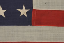 32 STARS, COMMEMORATING MINNESOTA STATEHOOD, CA 1892 - 1926, A VERY RARE FLAG, IN A SMALL SIZE, WITH AN HOURGLASS CONFIGURATION