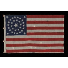 33 STAR ANTIQUE AMERICAN FLAG WITH A DOUBLE WREATH STAR CONFIGURATION, PRESS-DYED ON WOOL BUNTING, PROBABLY MADE FOR MILITARY USE AS CAMP COLORS OR A GUIDON, ONE-OF-A-KIND AMONG KNOWN EXAMPLES, WEST VIRGINIA STATEHOOD, 1863-1865