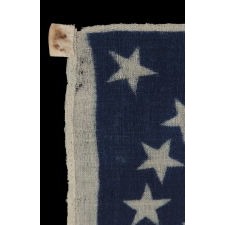 33 STAR ANTIQUE AMERICAN FLAG WITH A DOUBLE WREATH STAR CONFIGURATION, PRESS-DYED ON WOOL BUNTING, PROBABLY MADE FOR MILITARY USE AS CAMP COLORS OR A GUIDON, ONE-OF-A-KIND AMONG KNOWN EXAMPLES, WEST VIRGINIA STATEHOOD, 1863-1865