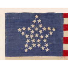 33 STARS ANTIQUE AMERICAN FLAG WITH A "GREAT STAR" CONFIGURATION ON A BRILLIANT, INDIGO BLUE CANTON, A RARE AND EXTRAORDINARY EXAMPLE, PRE-CIVIL WAR THROUGH THE WAR'S OPENING YEAR, 1859-1861, OREGON STATEHOOD