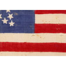 33 STARS ANTIQUE AMERICAN FLAG WITH A "GREAT STAR" CONFIGURATION ON A BRILLIANT, INDIGO BLUE CANTON, A RARE AND EXTRAORDINARY EXAMPLE, PRE-CIVIL WAR THROUGH THE WAR'S OPENING YEAR, 1859-1861, OREGON STATEHOOD