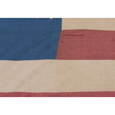 33 STARS IN A "GREAT STAR" OR "GREAT LUMINARY" PATTERN ON A HOMEMADE FLAG WITH A BEAUTIFUL, GLAZED COTTON CANTON, 1859-61, PRE-CIVIL WAR THROUGH WAR PERIOD, OREGON STATEHOOD